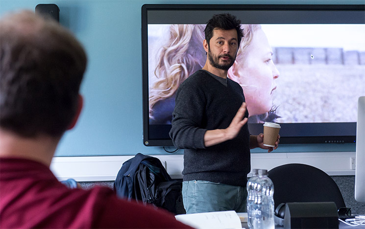Academic on a computer at the University of Sussex